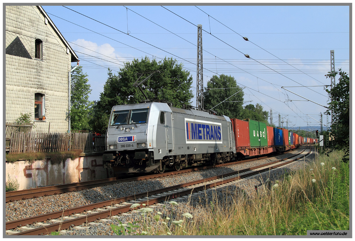 386 038